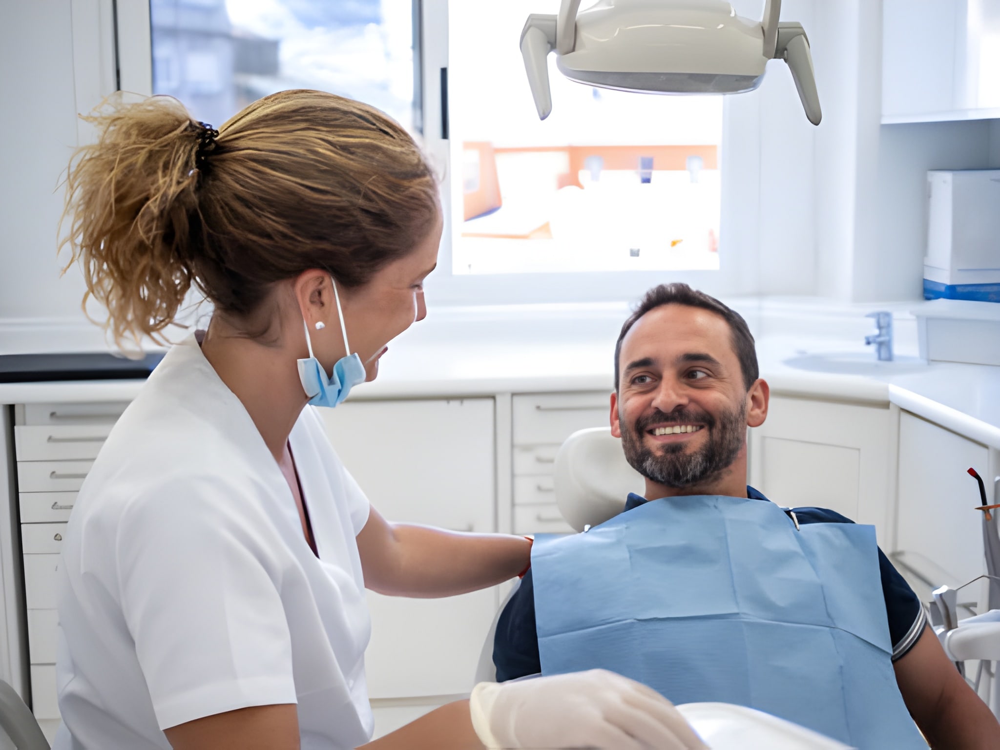 Professional dentist examining patient